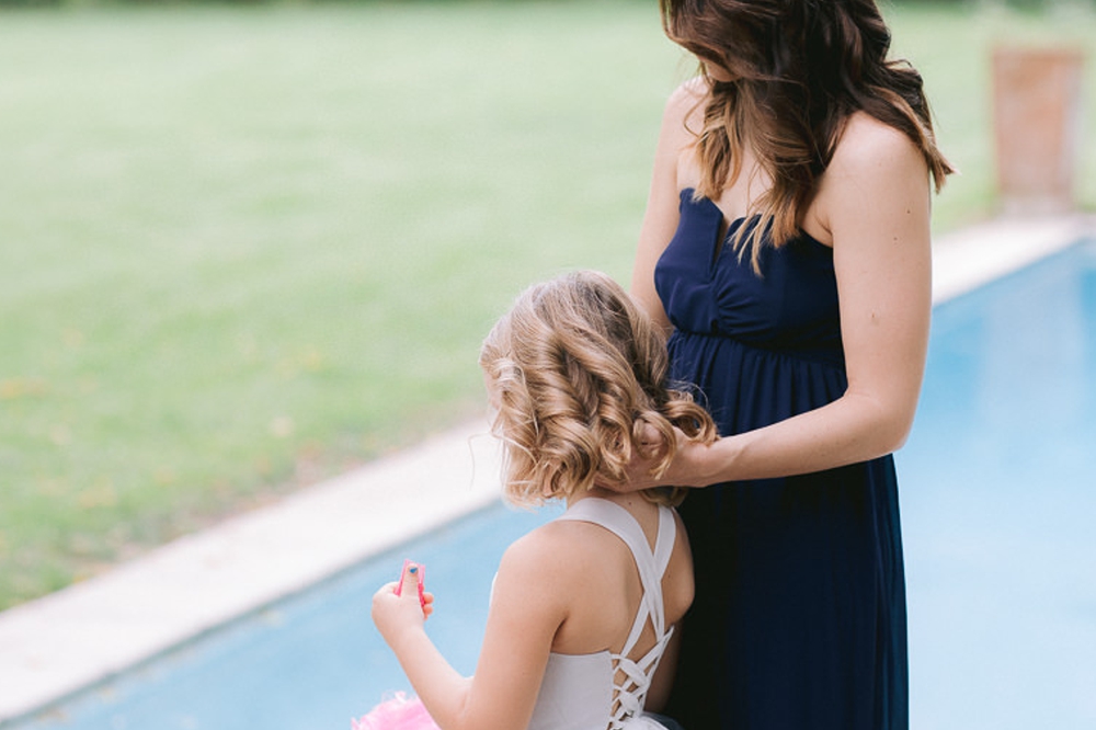 loving moment with flowergirl and mom