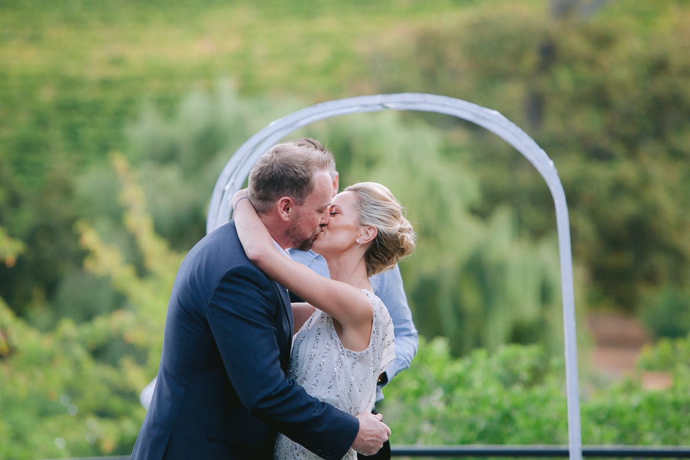 bride and groom kiss