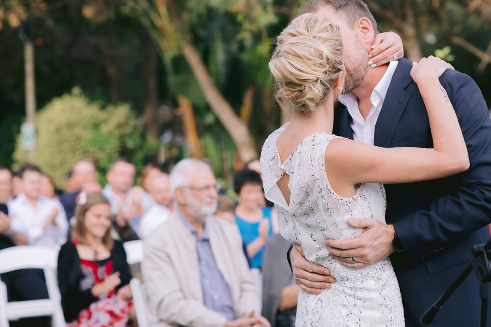 bride and groom kiss