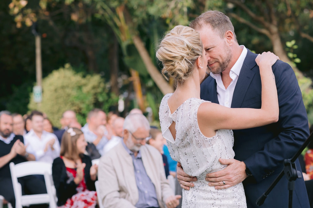 groom looks deeply into brides eyes