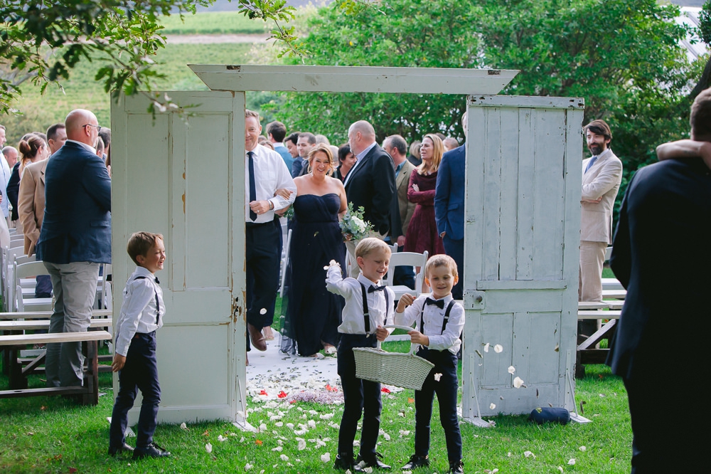page boys throwing confetti