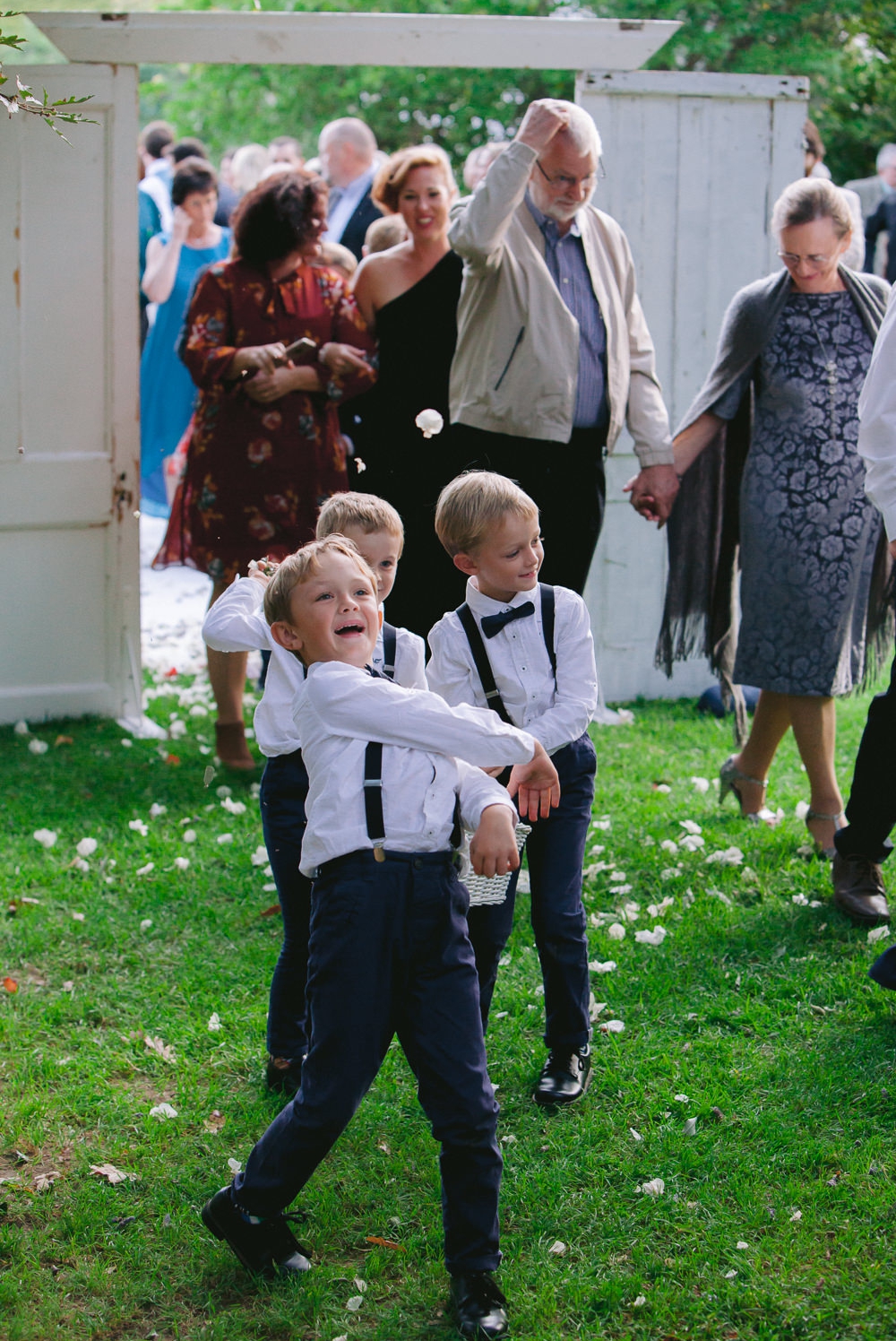 page boys throwing confetti